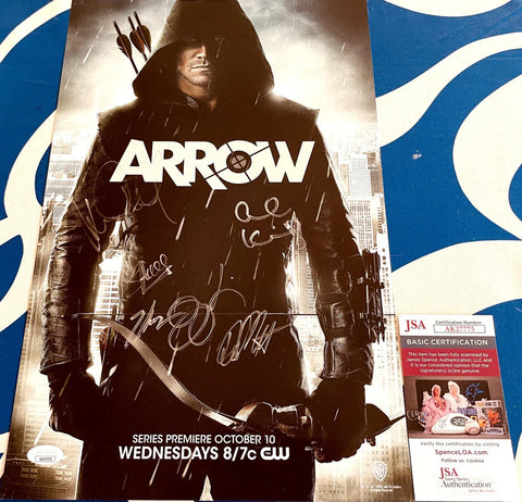 Signed Arrow TV show poster with hooded archer, bow, and JSA authentication card.