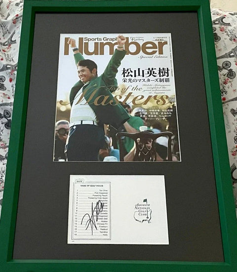 Framed Masters golf memorabilia with sports magazine cover and signed Augusta National scorecard.
