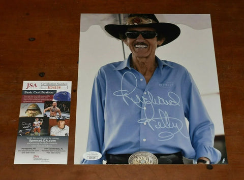 Autographed racing legend photo with JSA authentication card, ideal signed memorabilia