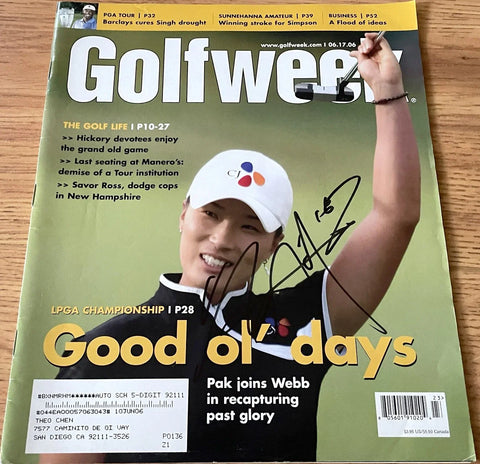 Signed Golfweek magazine featuring female golfer celebrating LPGA victory with raised putter.