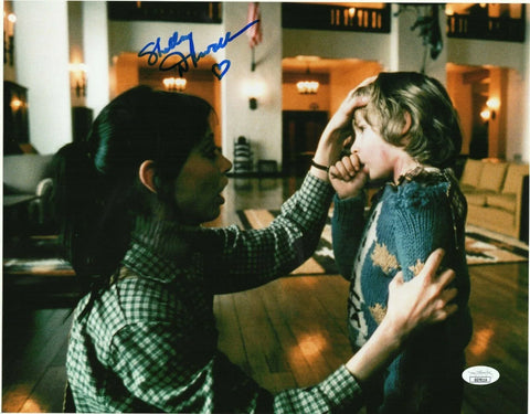 Signed movie still of woman comforting child in hotel lobby, autographed memorabilia photo
