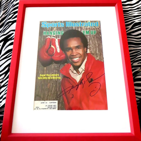 Framed signed Sports Illustrated magazine cover featuring a smiling boxer in red and red gloves.