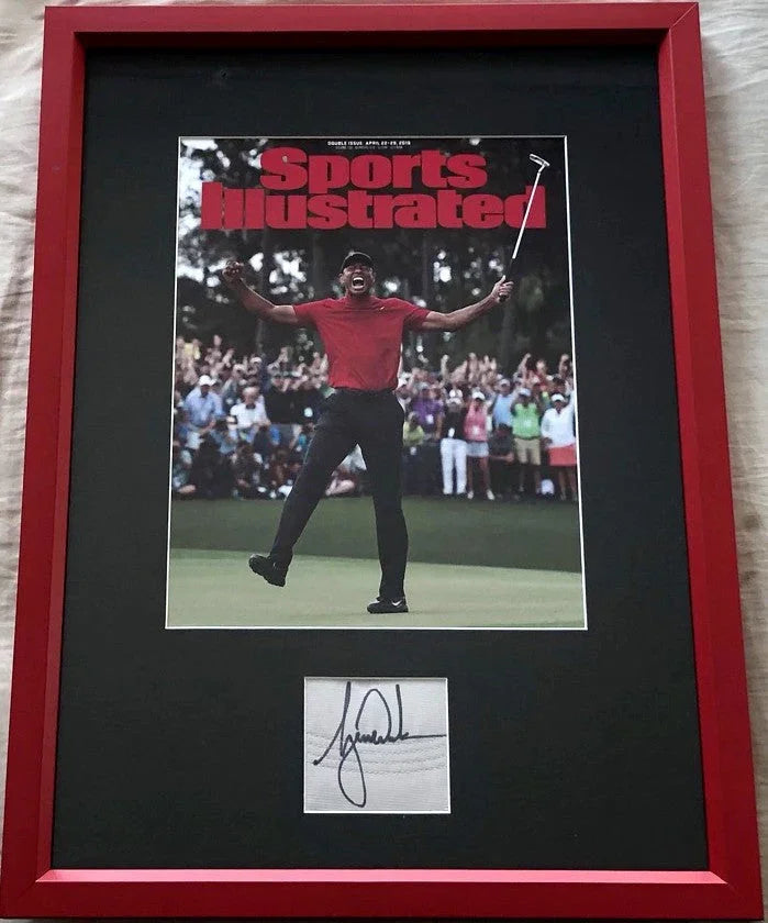 Framed Sports Illustrated cover photo of golfer celebrating with autograph display