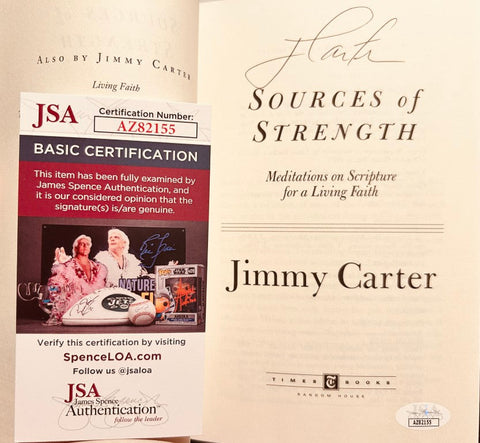Signed Jimmy Carter 'Sources of Strength' book with JSA authentication certificate visible.