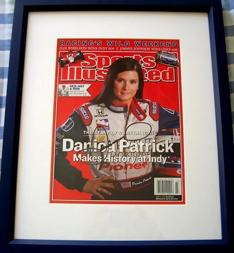 Framed Sports Illustrated cover featuring Danica Patrick in racing suit, collectible memorabilia