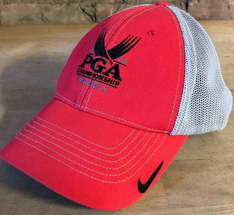 Red PGA Championship Valhalla golf cap with mesh back and Nike logo on wooden surface