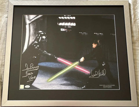 Framed autographed Star Wars photo with lightsaber duel between Darth Vader and Luke Skywalker.