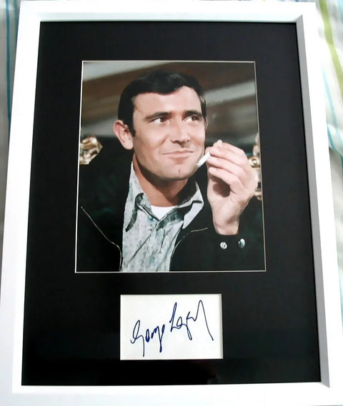 Framed celebrity photo with hand-signed autograph, memorabilia display