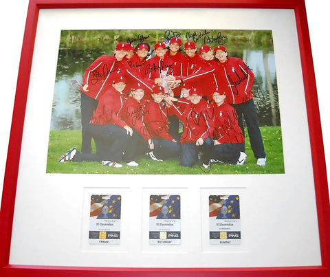 Framed LPGA team signed golf photo with three tournament passes, red border
