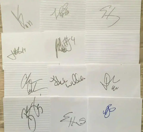 Collection of authentic sports autographs on lined paper, including NFL, NBA, MLB, and NHL signatures.
