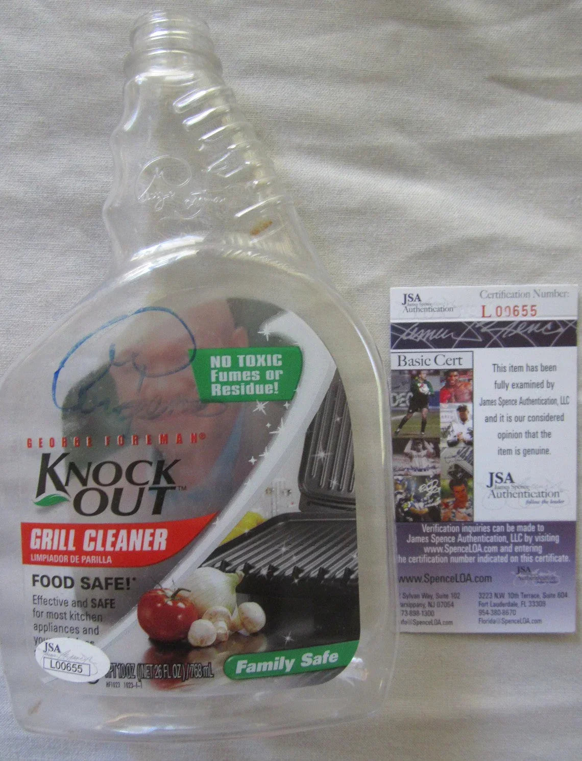 George Foreman autographed Knock Out Empty plastic Spray Bottle JSA - AutographsForSale.com