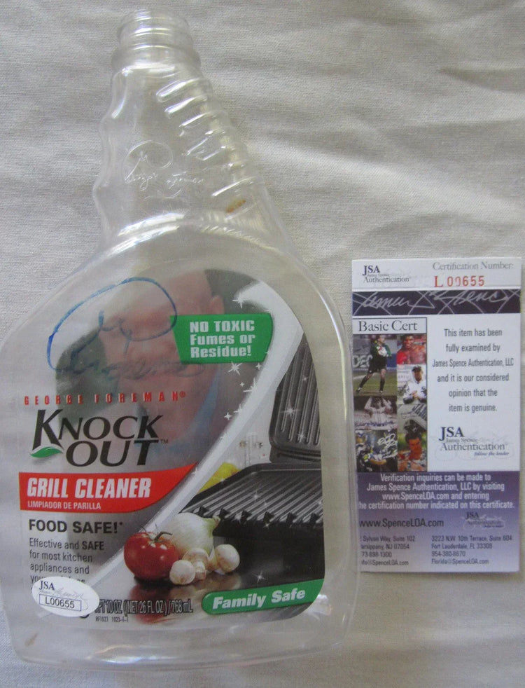 George Foreman autographed Knock Out Empty plastic Spray Bottle JSA - AutographsForSale.com