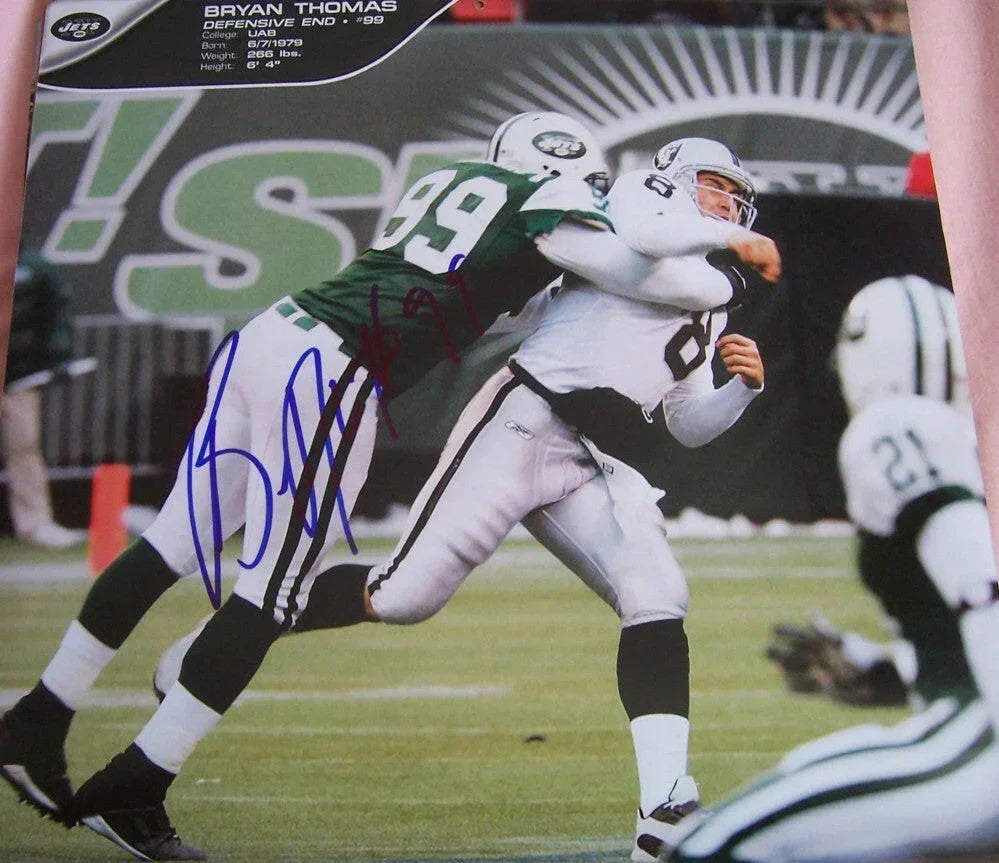 Bryan Thomas autographed New York Jets calendar page photo - AutographsForSale.com