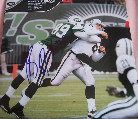 Bryan Thomas autographed New York Jets calendar page photo - AutographsForSale.com