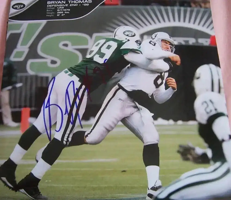 Bryan Thomas autographed New York Jets calendar page photo - AutographsForSale.com