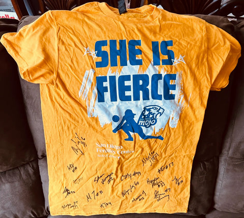 Yellow San Diego Mojo soccer team shirt with 'She Is Fierce' graphic, player signatures, and sponsor logo