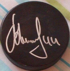 Alexei Zhitnik autographed hockey puck Flyers Sabres - AutographsForSale.com