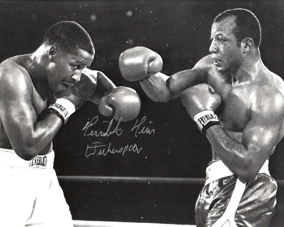 Tim Witherspoon autographed 8x10 boxing photo - AutographsForSale.com