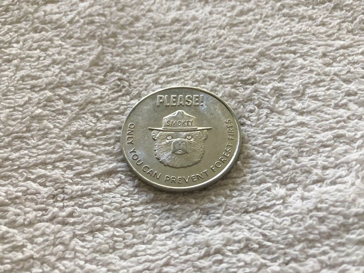 Smokey the Bear vintage 1960s aluminum coin - AutographsForSale.com