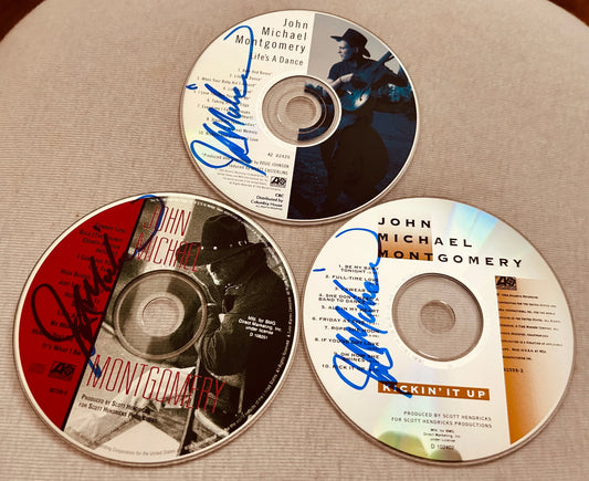 Set of 3 John Michael Montgomery autographed CD albums - AutographsForSale.com