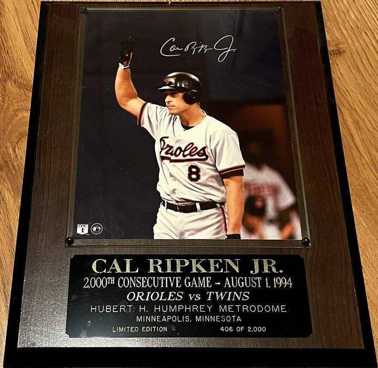 Cal Ripken autographed Orioles 2000 Consecutive Games 8x10 photo in plaque - AutographsForSale.com