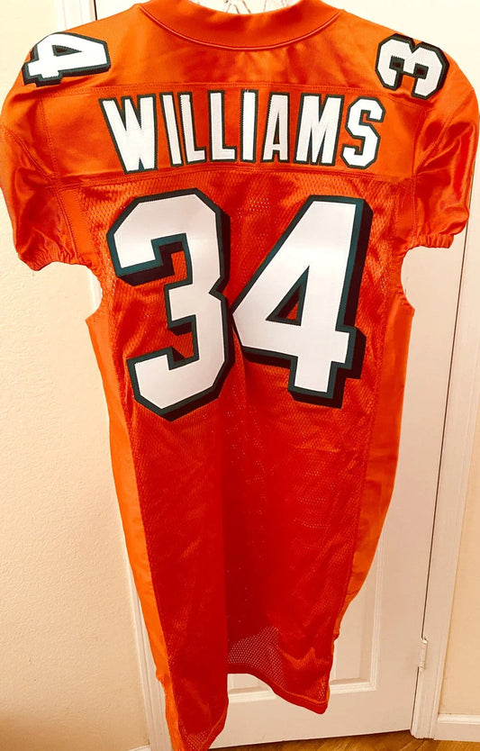 Ricky Williams Dolphins 2010 Reebok team issued orange jersey - AutographsForSale.com