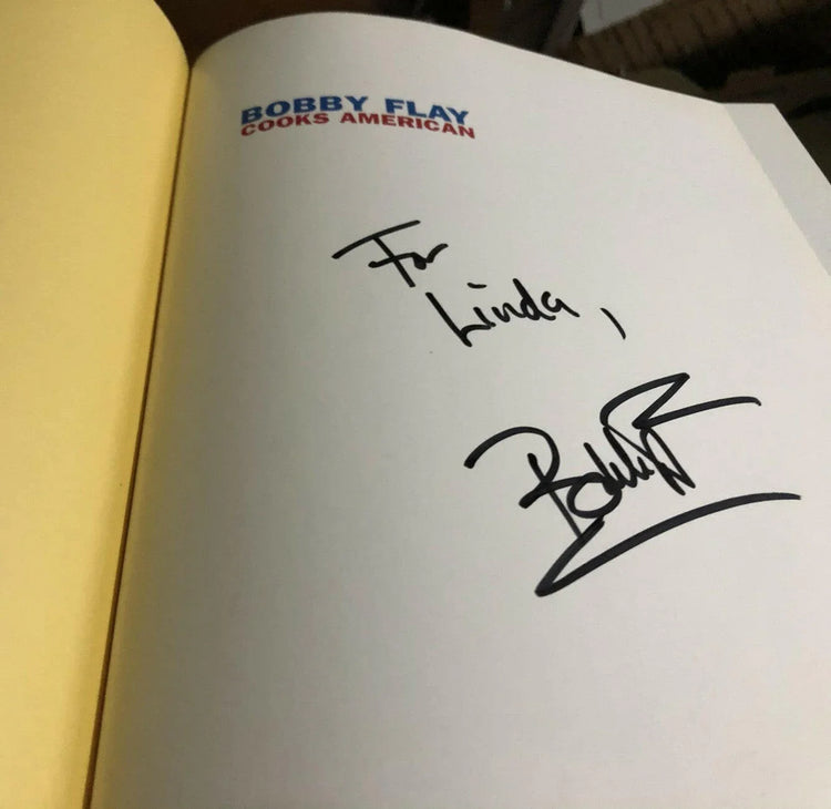 Bobby Flay autographed Cooks American hardcover Cookbook For Linda - AutographsForSale.com