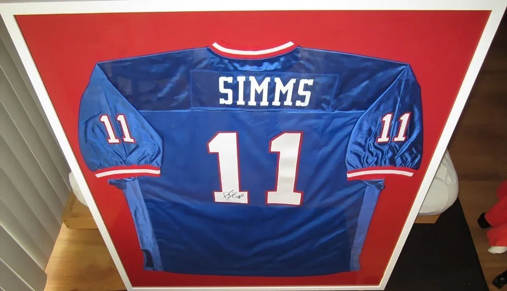 Phil Simms autographed New York Giants stitched blue jersey framed - AutographsForSale.com