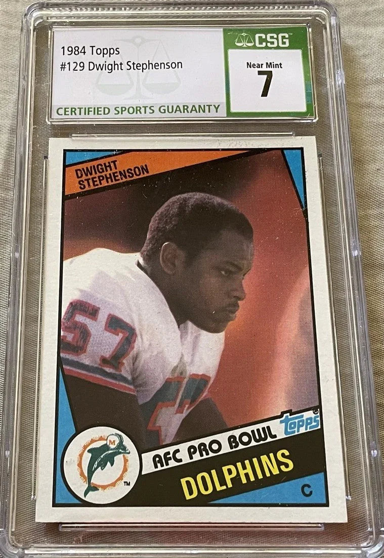 Dwight Stephenson Miami Dolphins 1984 Topps Rookie Card #129 Graded CSG 7 near Mint - AutographsForSale.com