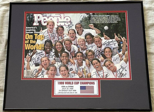 Framed 1999 People magazine cover autographed by US Women’s World Cup soccer team.