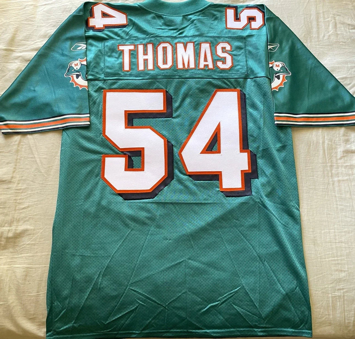Zach Thomas Miami Dolphins 2002 to 2007 authentic Reebok stitched aqua jersey NEW - AutographsForSale.com