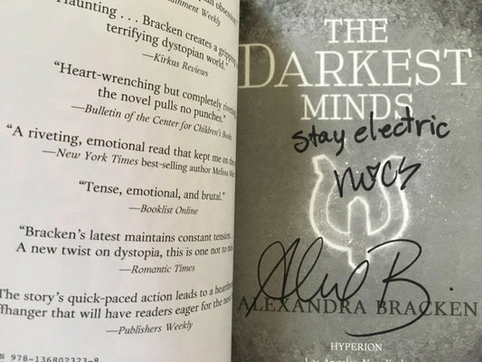 Alexandra Bracken and Miya Cech autographed Darkest Minds movie edition paperback book - AutographsForSale.com