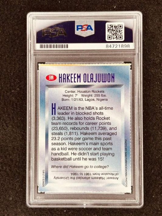 Hakeem Olajuwon signed Rockets 1997 SI for Kids card PSA/DNA - AutographsForSale.com