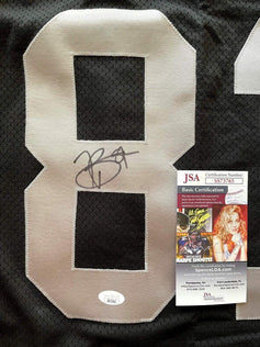 Tim Brown signed Raiders Reebok black game model jersey JSA - AutographsForSale.com