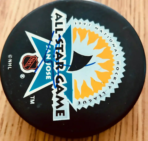 Brodeur1997ASGPuck_3bfddaec-bf73-4271-8e6a-bc61415f44ef - AutographsForSale.com