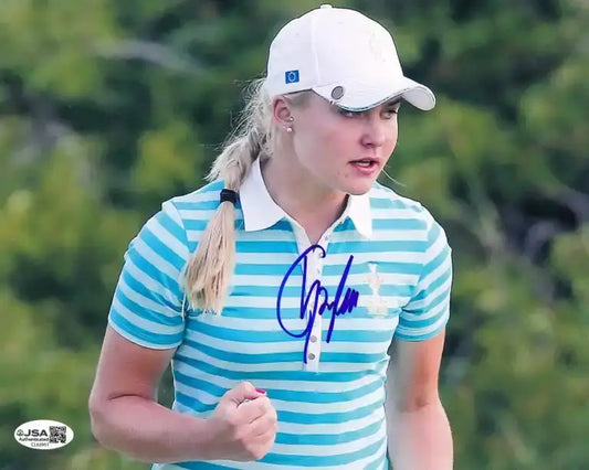 Autographed photo of golfer in striped polo, JSA authenticated, perfect for golf memorabilia collectors