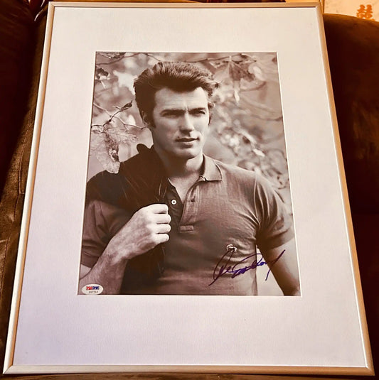 Framed autographed photo of a man in a polo shirt, signed with PSA/DNA authentication.