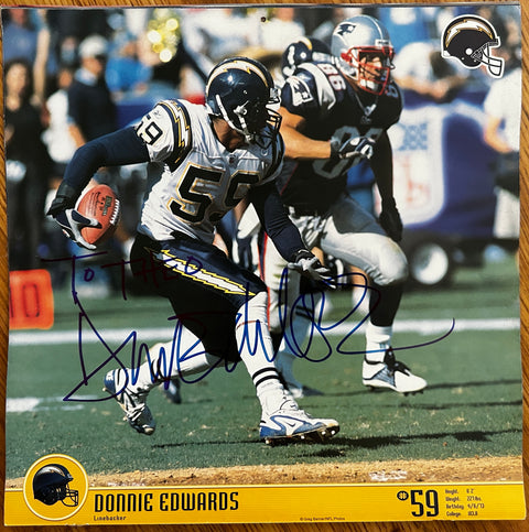 Donnie Edwards signed 2004 San Diego Chargers calendar photo (To Theo) - AutographsForSale.com