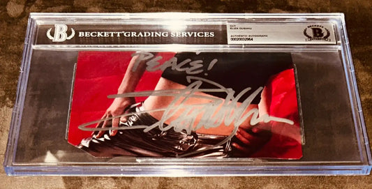 Beckett authenticated signed memorabilia card with silver autograph and handwritten message.