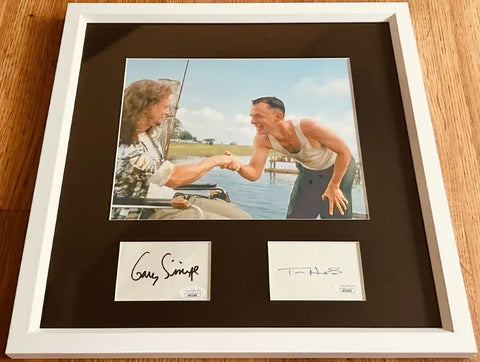 Framed autographed photo of Gary Sinise and Tom Hanks shaking hands, signed memorabilia for collectors