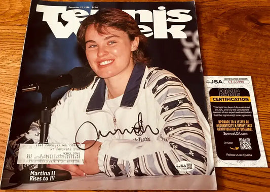 Autographed Tennis Week magazine cover featuring Martina Hingis, certified by JSA, ideal for tennis memorabilia collectors.