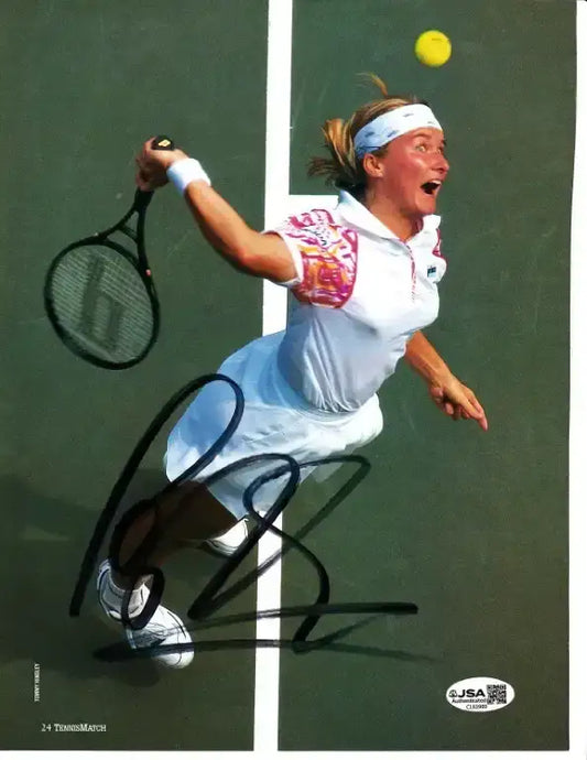 Autographed tennis photo of player mid-swing, JSA certified, authentic sports memorabilia