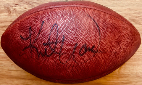 Signed NFL football with autograph on textured leather, authentic sports memorabilia
