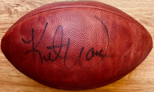 Signed NFL football with autograph on textured leather, authentic sports memorabilia