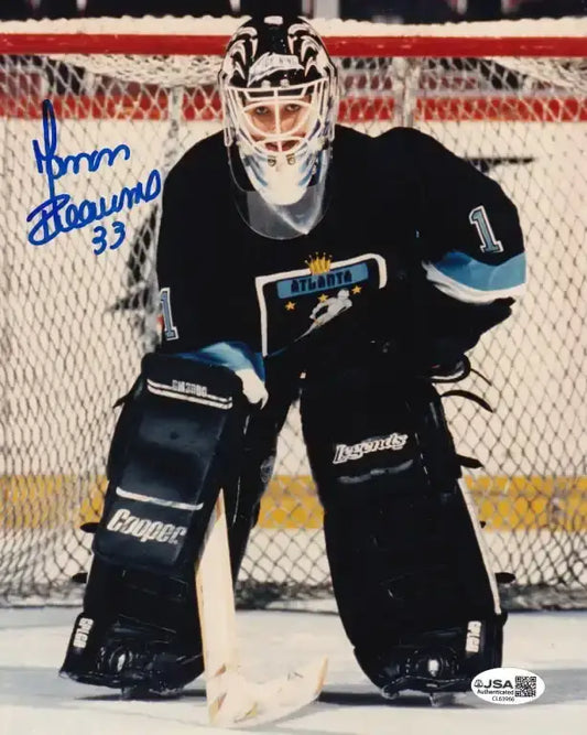 Autographed photo of NHL goalie in Atlanta Thrashers uniform, signed in blue ink, JSA authenticated