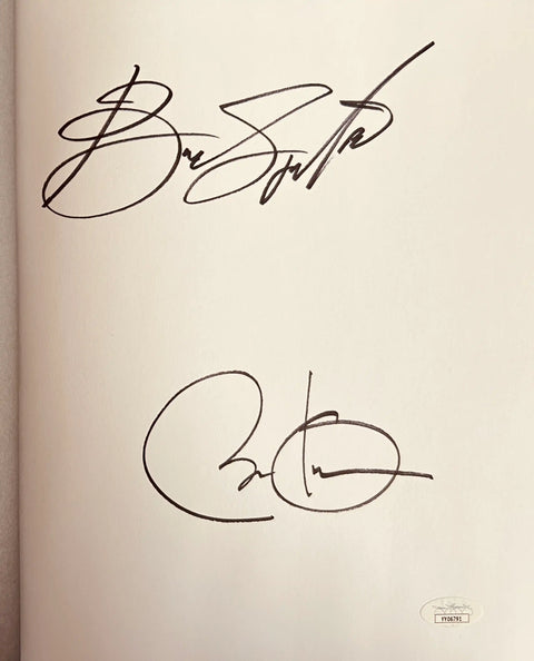Signed book page with two large autographs and an authentication sticker, memorabilia