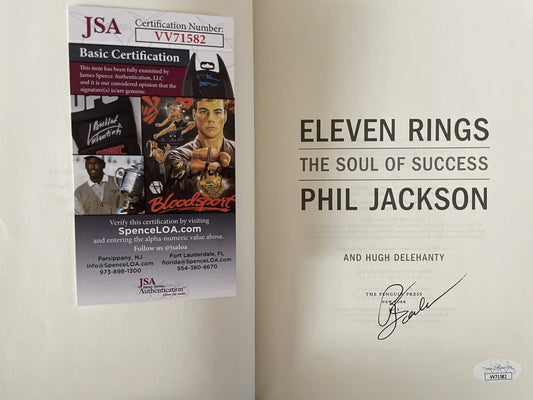 Signed title page of Phil Jackson's book Eleven Rings with JSA Basic Certification card VV71582 for autograph authenticity