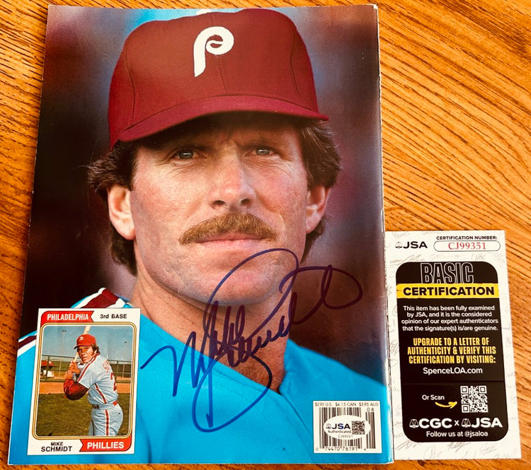 Signed Philadelphia Phillies baseball photo with authenticity certificate on wood table