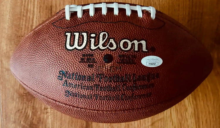 Wilson NFL football with 75th anniversary marking, JSA authentication sticker, brown leather