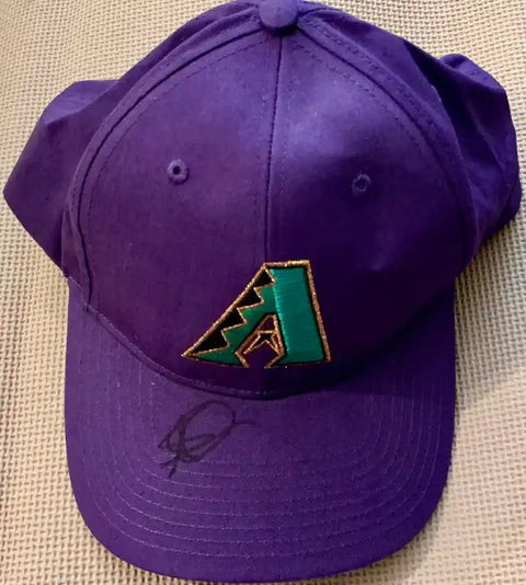 Purple Arizona Diamondbacks cap with green logo and autograph